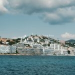 investing in ibiza property, white apartments on the shoreline